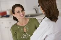 Photo of woman talking with her doctor